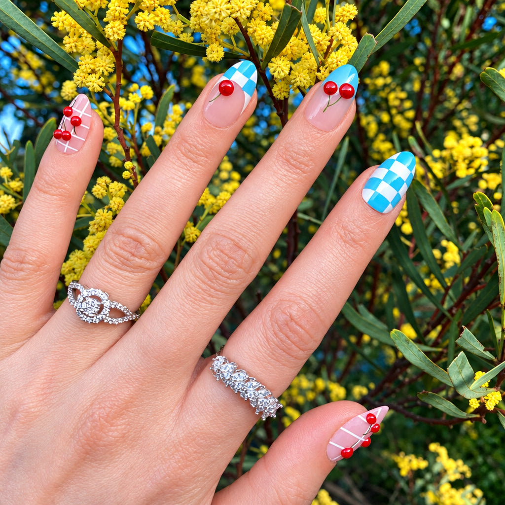 Cherry checkered press-on nails spread hand view