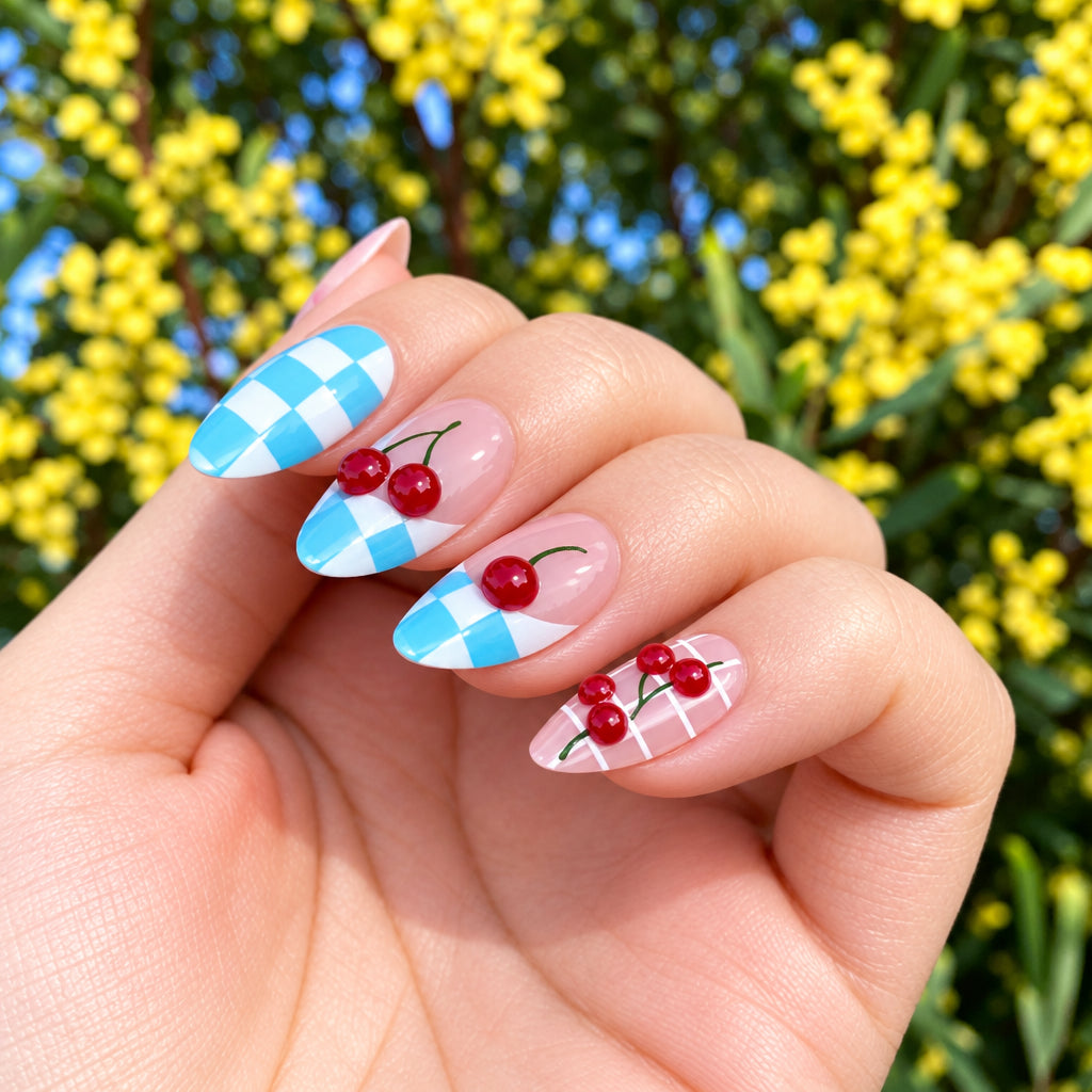 Cherry checkered press-on nails close-up