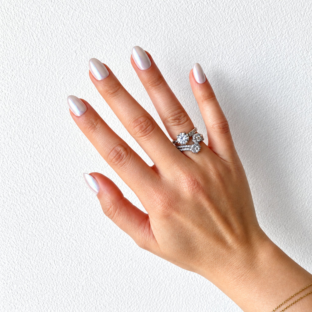 Milky white pearl chrome press-on nails flat hand spread with rings