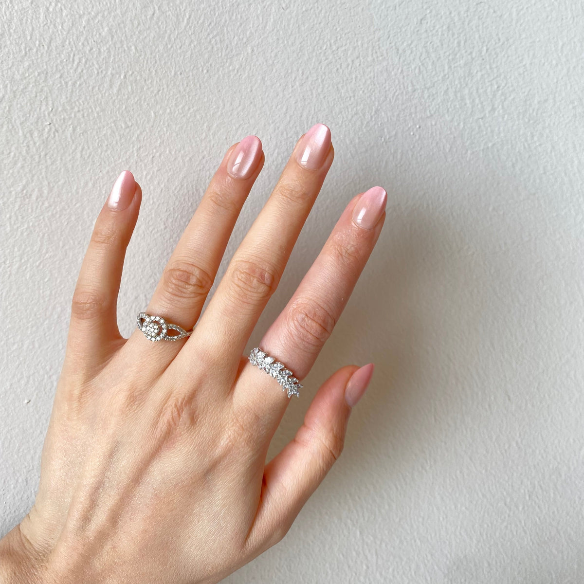 Pearl blush chrome press-on nails spread hand pose